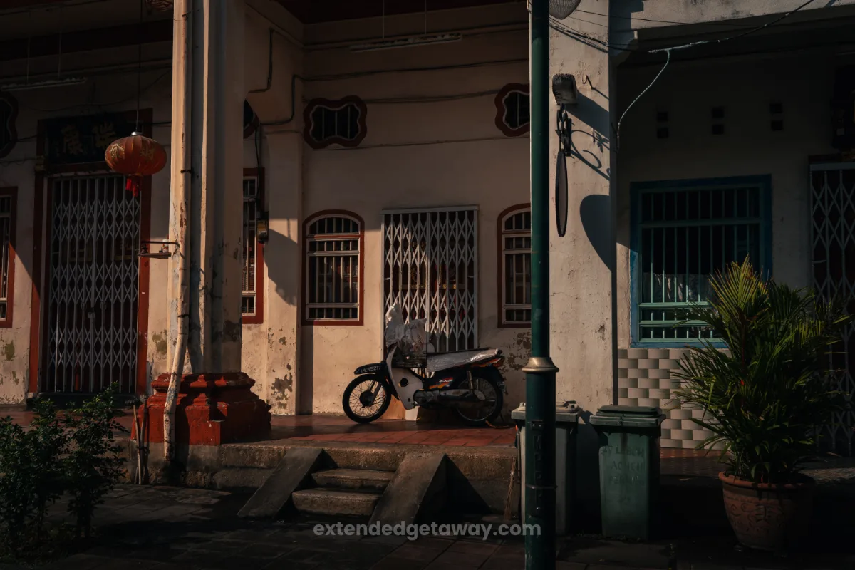 penang in 3 days itinerary, a bike parked in front of someone's front door