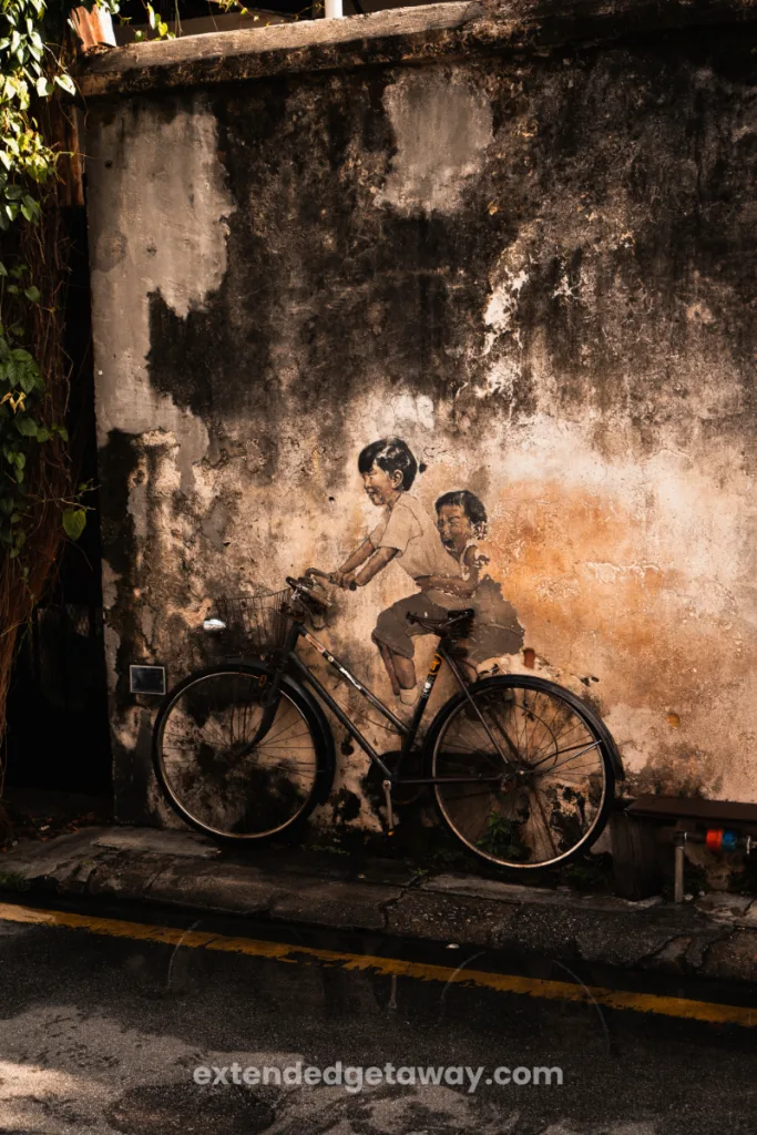 Kids on bicycle street art penang